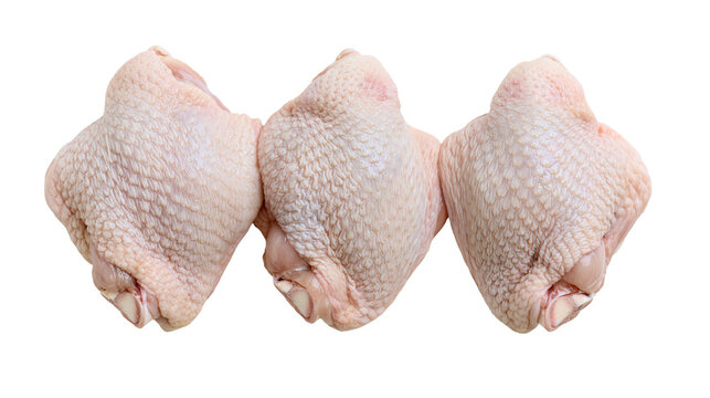 Three raw chicken thighs with skin, isolated on transparent background