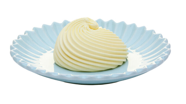 Swirled yellow butter portion on a light blue fluted dish, isolated on transparent background