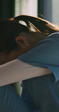 Sad, nurse and woman thinking of medical mistake in hospital, burnout and healthcare career. Stress, doubt and female person with depression or tired of surgery with worry, regret or fatigue