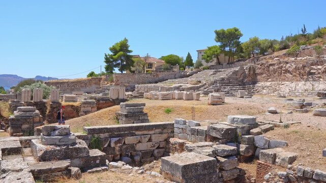 Tourist exploring the Greek archaeological site of Eleusis
