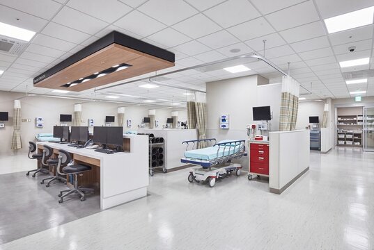 Modern hospital nursing station beside clinical ward rooms - wide angle view