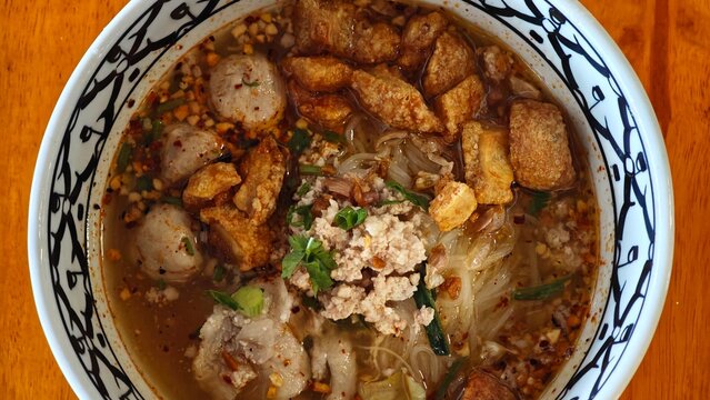 Pink Noodles (fermented bean curd sauce) with fish ball.
