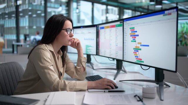 Agile Manager Reviews Project Schedule On Computer