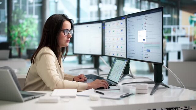 Software Engineer Analyzes AI-powered Knowledge Base On Laptop