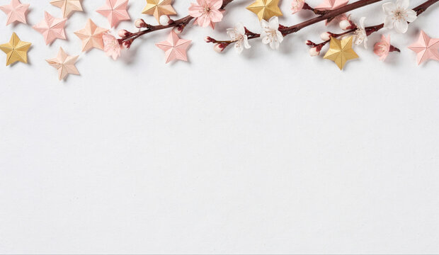 Origami Stars and Cherry Blossom Branch on White Backdrop