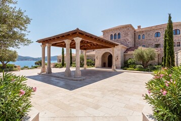 Fototapeta premium Mediterranean luxury hotel architecture with scenic outdoor space