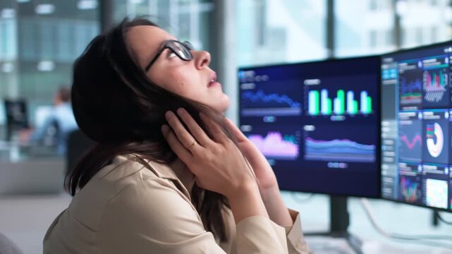 Woman At Office Computer Looking Stressed And Overwhelmed