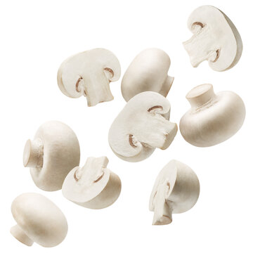 Sliced and whole white button mushrooms isolated