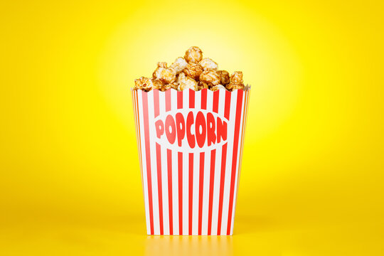 Popcorn bucket on bright yellow background