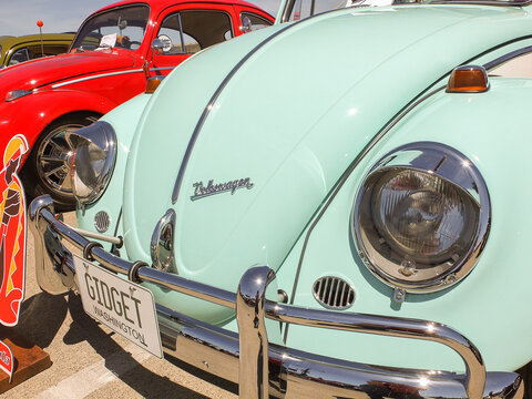 Close-up of a mint green classic Volkswagen Beetle at a car show in Ruston - June 13, 2026 Ruston WA, USA
