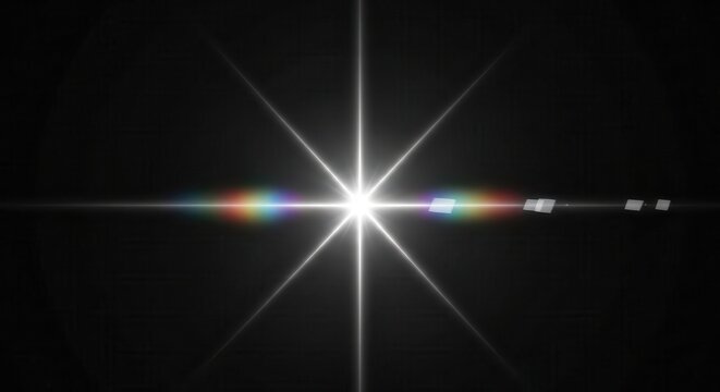 Bright White Starburst with Anamorphic Lens Flare and Rainbow Spectrum Light Effect on Dark Background
