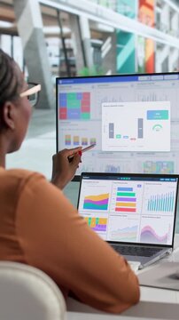 Financial Analyst Carefully Examines Data On Laptop