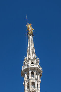 the Milan cathedral rooftop features the largest walkable Gothic roof in the world and the iconic gold Madonnina statue
