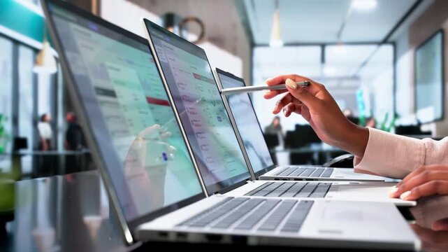 Compliance Officer Monitors Real-time Alerts On Laptop