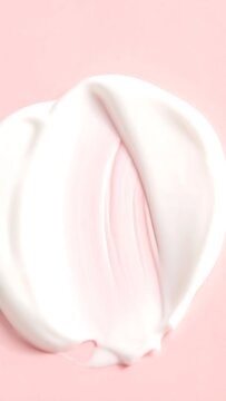 Soft White Cream Swirl Resting on Pastel Pink Background