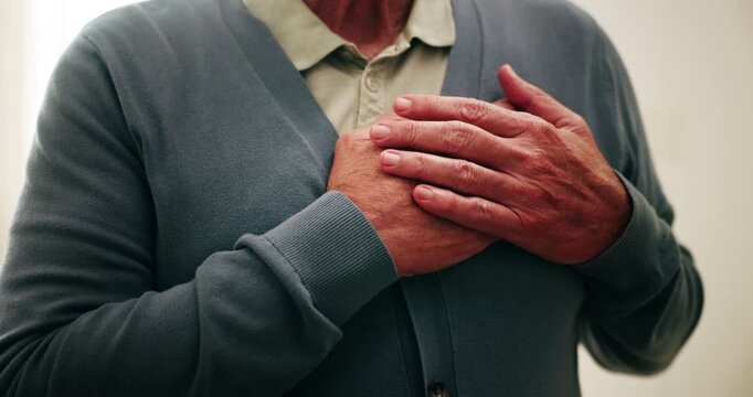Hands, chest pain and senior man in home with discomfort, angina or heart attack symptoms. Respiratory illness, medical emergency and elderly person with cardiac problem, asthma or artery disease.