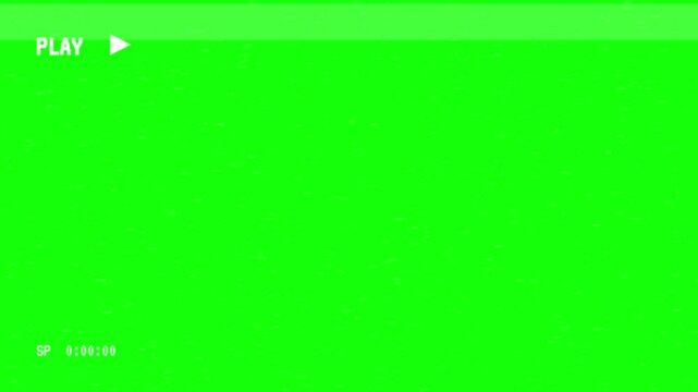 Vintage video cassette recorder screen overlay with play button and time code on green screen