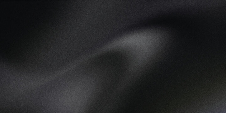 Sandblasted or brushed titanium or steel metal surface, the light reflection of the curved lines creates a smooth gradation on the dark black metallic background