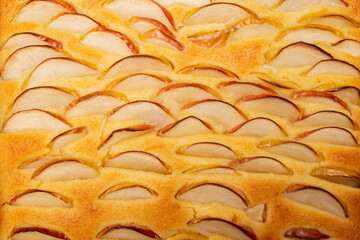 Apple slices on a tart or pie, side view close up © Dorin