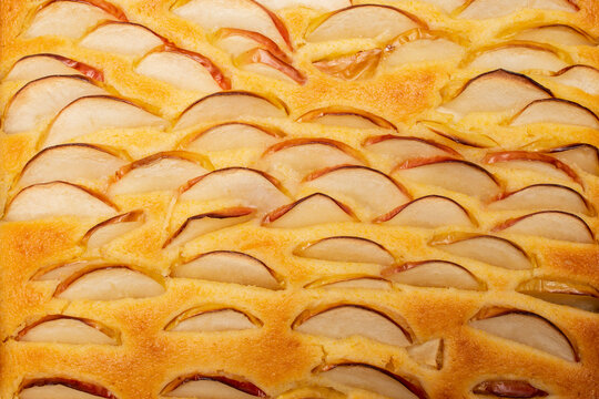 Apple slices on a tart or pie, side view close up