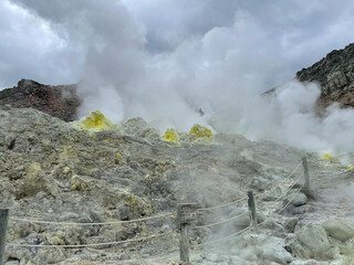 Fototapeta premium Steam Rising from a Rocky Geothermal Fumarole