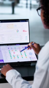 Procurement Manager Reviews Supplier Bids On Laptop