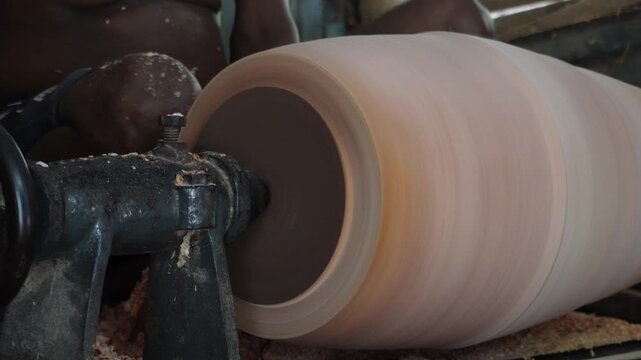 Woodturning Process on Lathe with Flying Shavings
