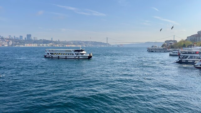 Passenger Boat Cruising on Bosphorus with Istanbul Cityscape View