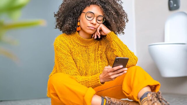Woman scrolling through smartphone while sitting on the floor in a bathroom Generative AI