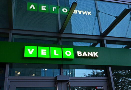 Warsaw, Poland, Europe - 04.2026 : Polish Universal Bank - VeloBank SA, Getin Noble Bank special resolution regime, sign neon, headquarters in Warsaw Hub complex, Daszyńskiego roundabout