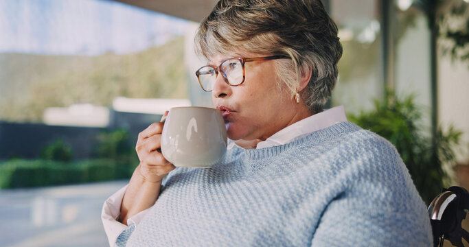 Senior, woman and thinking with tea in wheelchair for herbal beverage or comfort in home. Thoughtful, vision or female person with a disability, cup or mug for morning drink, sight or memory in house