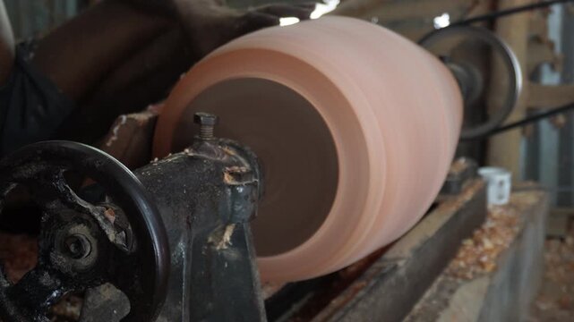 Woodturning on Lathe with Shavings in Workshop