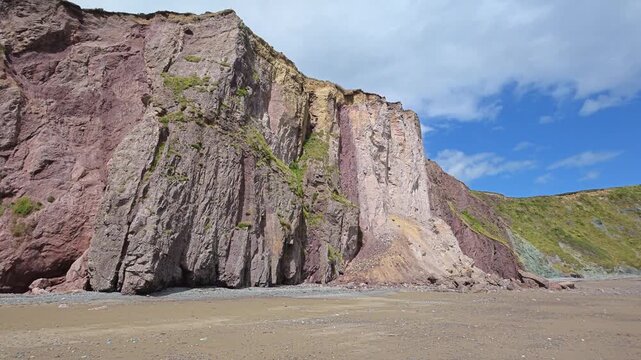 Coastal erosion on Irish beaches due to climate change large rockfall at tourist beach Copper Coast Waterford Ireland Epic Locations