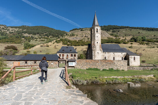 hiker in Sanctuary of Our Lady of Montgarri, year 1117, High Aran Valley, Lleida, Catalonia, Spain