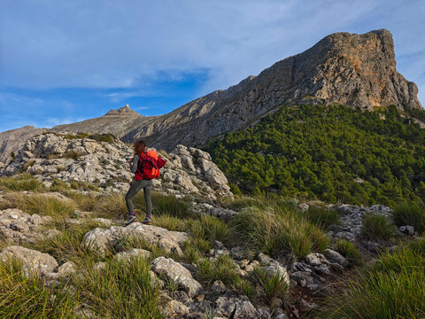 hiker in front of Puig Major mountain, Cards Colers pass, Fornalutx, Natural area of the Serra de Tramuntana., Majorca, Balearic Islands, Spain