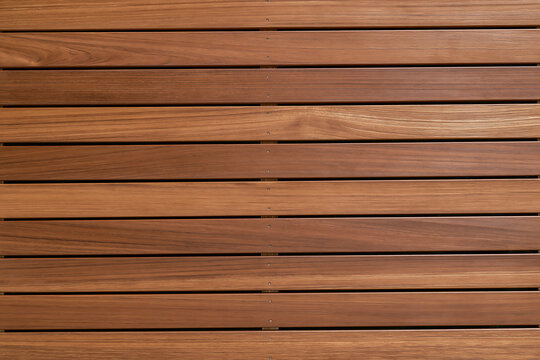 Exterior Grade Real Wood Decking Planks with Fasteners in Straight Linear Pattern Background
