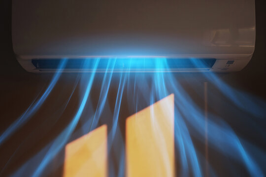 Wall mounted split air conditioner blowing cool blue airflow in modern home interior