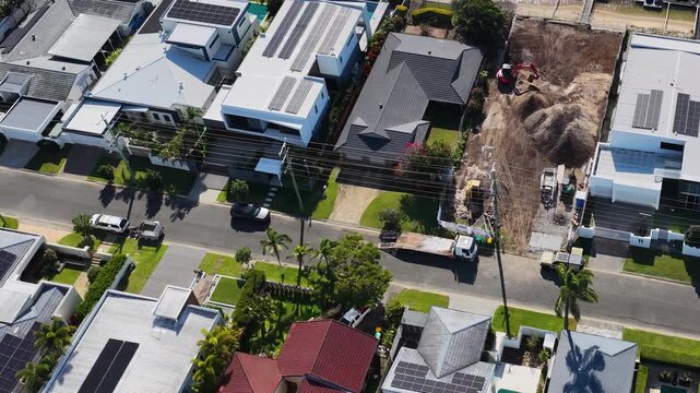 Aerial View of Residential Construction Site and Luxury Waterfront Homes