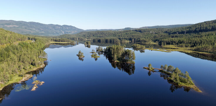 Norwegian lake with islands and reflections, Buskerud, Norway