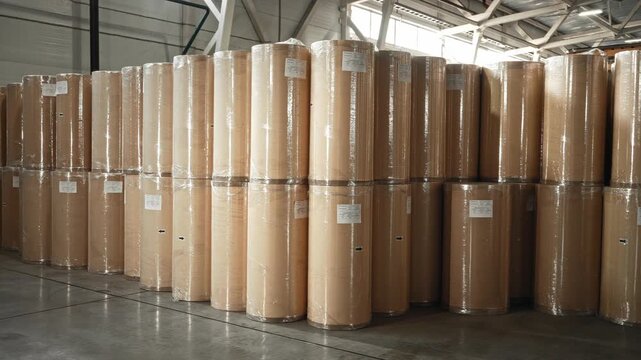 Packaging Inspection Underway. Fine Quality Check Occurring On Wrapped Kraft Paper In Storage Area