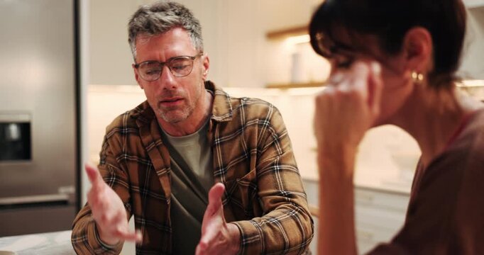 Stress, couple and argument in kitchen for marriage problem, divorce and toxic relationship. Mature man, woman and quarrel at home, fight and frustrated partner with conflict for cheating affair