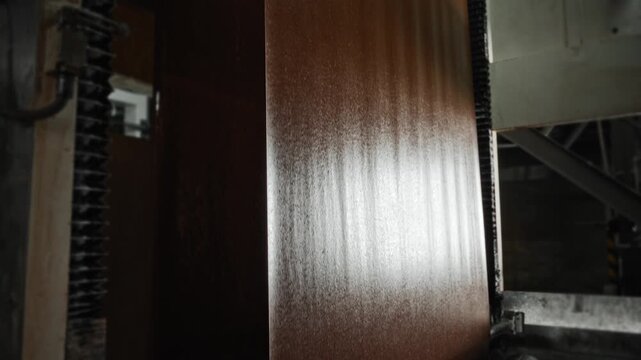 Industrial Setting With Careful Examination Of Glossy Kraft Web Readiness For Packaging And Storage