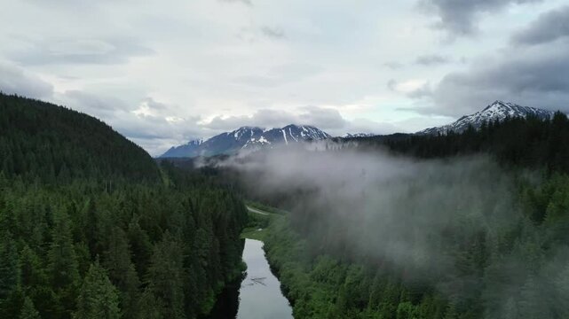 Rolling Fog over Lake and Mountains in Alaska