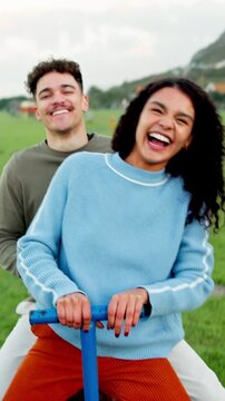 Face, fun and laughing with couple on seesaw in park for holiday, vacation or weekend. Happy, portrait and pov with people at outdoor playground in nature for date with energy, excitement or wellness