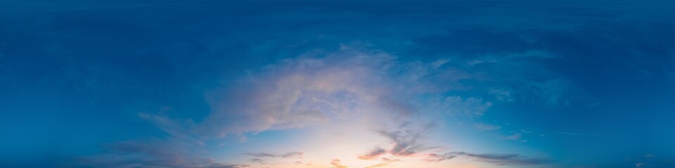 Obraz premium Sky panorama sunset showing beautiful clouds across a 360 degree equirectangular vista for hdri environment mapping and background use