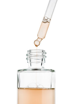 Cosmetic serum gel bottle with dropper, isolated on white background.