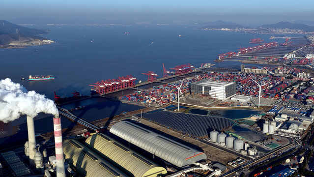 Aerial view industrial port landscape wind turbine solar panel power plant. Renewable eco energy facility integration, factory infrastructure. Sustainable station development. Shipping containers hub.
