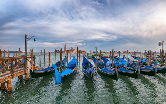 Amazing  landscape with Church of San Giorgio Maggiore  and gondolas parked beside the Riva degli Schiavoni in Venice