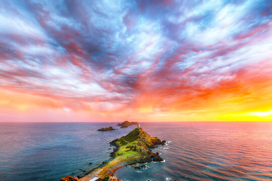 Amazing sunset over Torra di a Parata with Genoese Tower and Archipelago of Sanguinaires islands at background.