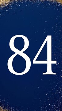 Gold Glitter Blow‑Away Reveal of Number 84 on Solid Background